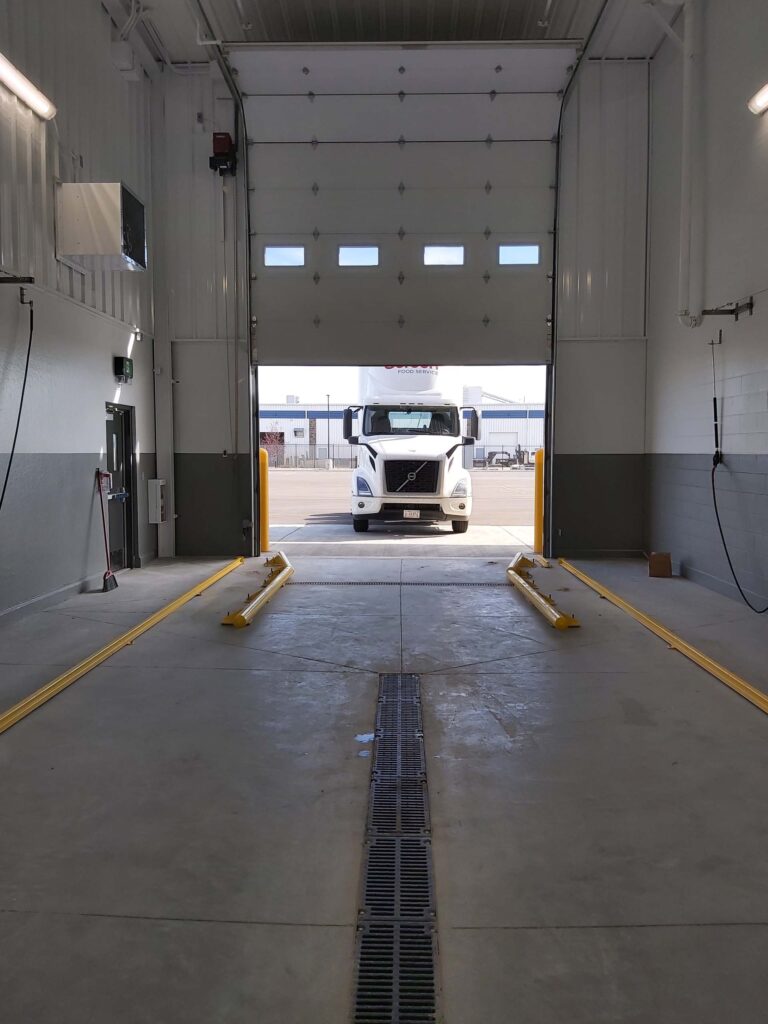 Close up of a semi truck approaching the truck wash