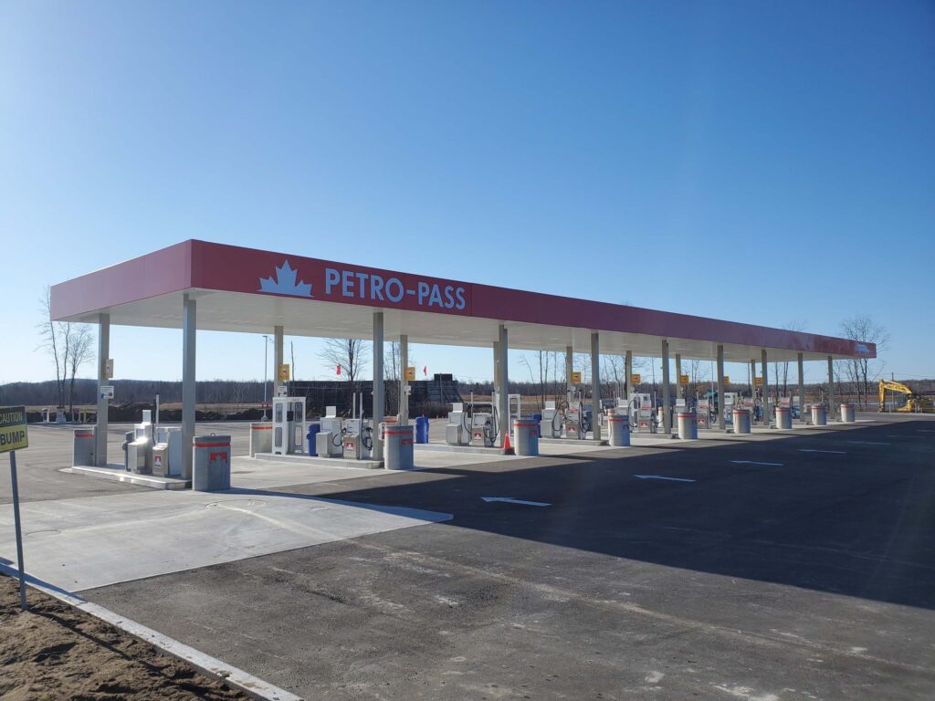 A large row of diesel pumps at a semi truck gas station