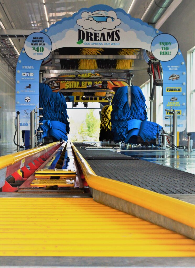 Inside the soft touch conveyor car wash looking from the ground